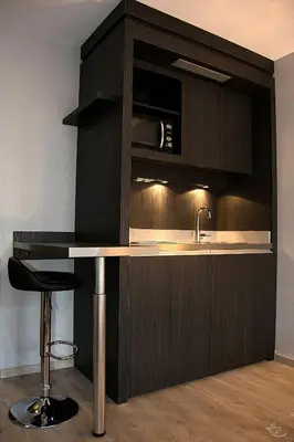 a kitchen with a counter and a sink at Séjours & Affaires Aix-en-Provence Mirabeau in Aix-en-Provence