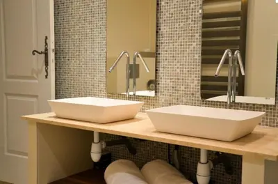 two sinks on a counter in a bathroom at Mas Le 7 in Saint-Andiol