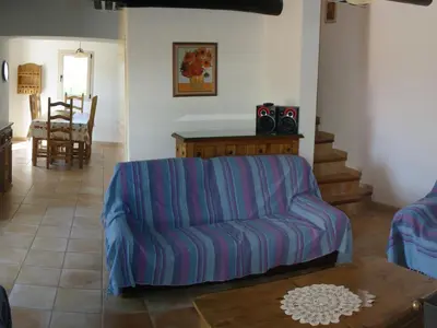 a living room with a couch and a table at Demeure d'hôtes et Mas Maurice in Oppède
