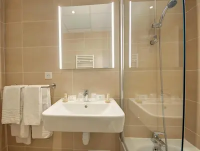 a bathroom with a sink and a shower at Best Western Domaine de Roquerousse in Salon-de-Provence