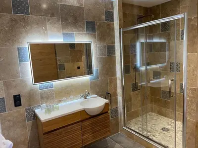 a bathroom with a sink and a shower at MAS aux CEDRES in Lioux
