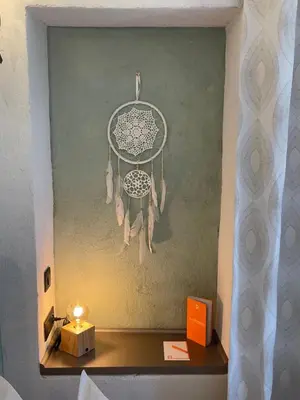 a chandelier hanging from a wall in a room at MAS aux CEDRES in Lioux