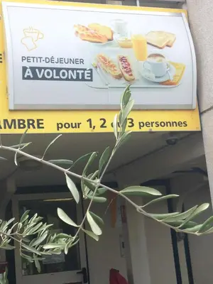 a sign for a restaurant with a plate of sandwiches at Premiere Classe Salon De Provence in Salon-de-Provence