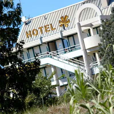 a hotel with a sign on the side of it at Premiere Classe Salon De Provence in Salon-de-Provence