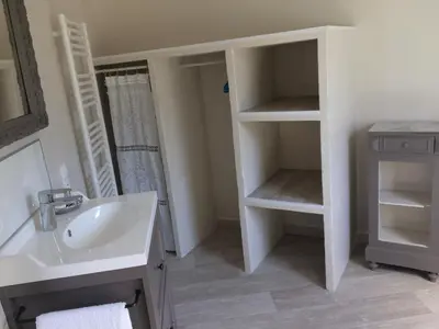 a white bathroom with a sink and a mirror at L'ATELIER JONQUERETTES in Jonquerettes