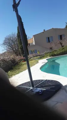 a view of a swimming pool with a mop at Le Samaro in Puyvert