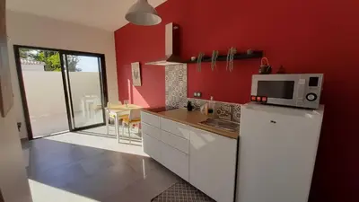 a kitchen with a white refrigerator and a microwave at Villa Quatra aux portes d'Aix-en-Provence in Éguilles