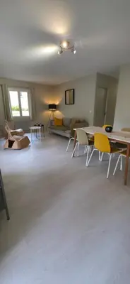 a living room with a table and chairs and a couch at Gîte Charmant avec Piscine et Terrasse en Provence MDV in Carpentras