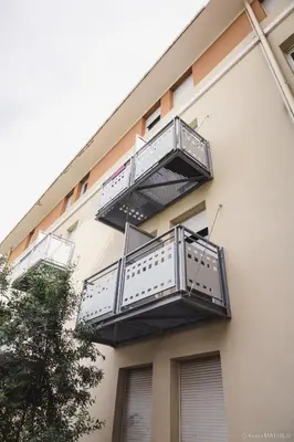 two balconies on the side of a building at Résidence Les Académies Aixoise in Aix-en-Provence