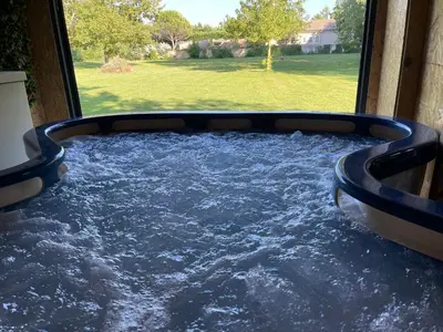a pool of water in a room with a window at DEPENDANCE PRIVEE - HALTE ROUTE in Le Thor