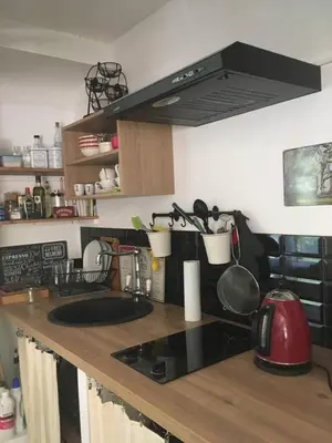 a kitchen with a counter top with a sink at Havre de paix en Provence in Lauris