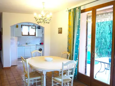 a kitchen and dining room with a table and chairs at Holiday Home near Mont Ventoux Ski Resort in Bédoin