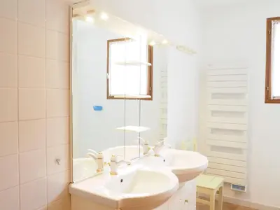 a white bathroom with a sink and a mirror at Holiday Home near Mont Ventoux Ski Resort in Bédoin