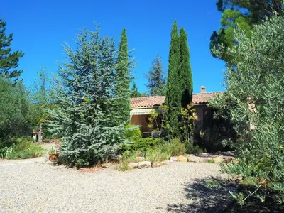 a house with trees and a gravel yard at Holiday Home near Mont Ventoux Ski Resort in Bédoin