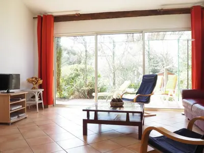 a living room with a couch and a table at Holiday Home near Mont Ventoux Ski Resort in Bédoin