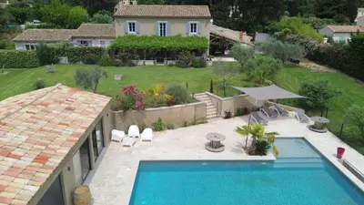an aerial view of a house with a swimming pool at Mas Carla in Noves