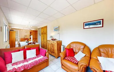 a living room with two leather couches at 2 Bedroom Gorgeous Apartment In Caromb in Caromb