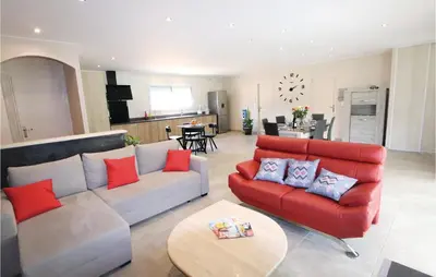 a living room with a couch and a table at Stunning Home In Monteux in Monteux