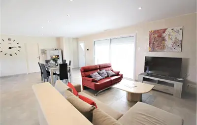 a living room with a couch and a table at Stunning Home In Monteux in Monteux