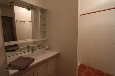 a bathroom with a sink and a mirror at CLOS DE LA FONT in Mollégès