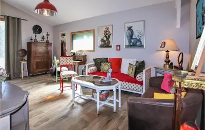 a living room with a couch and a table at Stunning Home In Saignon in Saignon