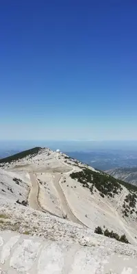 a dirt road on top of a snow covered mountain at Gîte Pilpoil in Sault-de-Vaucluse