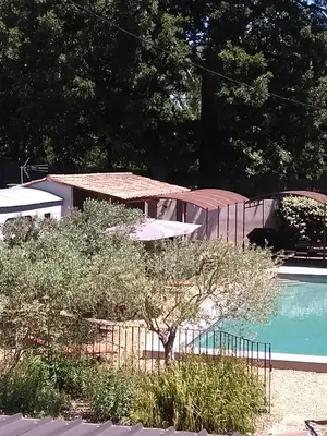 a house with a swimming pool and a building at Mas de Camejean in Lambesc