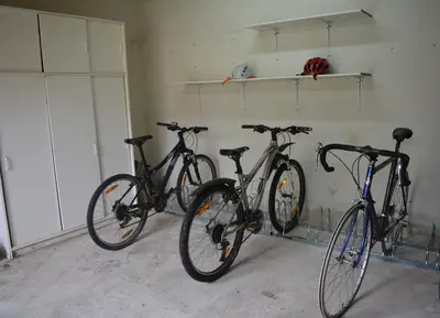 a group of three bikes parked in a garage at Maison le Pastaga in Caromb