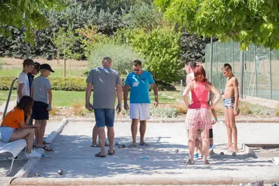 a group of people standing around in a park at Vacances Bleues Hôtel Castel Luberon in Apt