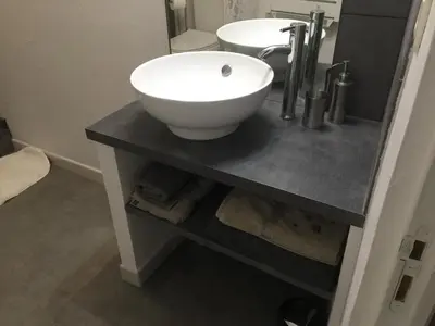 a bathroom with a white bowl sink on a counter at Maison de village - Monteux centre - Provence in Monteux