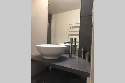 a bathroom with a large white bowl sink on a counter at Maison de village - Monteux centre - Provence in Monteux