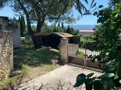 a gate in a yard with a fence at La Forge - Gordes in Gordes