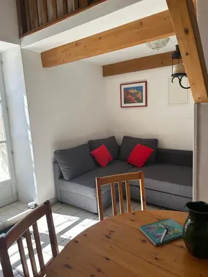 a living room with a couch and a table at La Forge - Gordes in Gordes