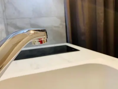 a close up of a bathroom sink with a faucet at MAZZARIN STUDIO in Aix-en-Provence
