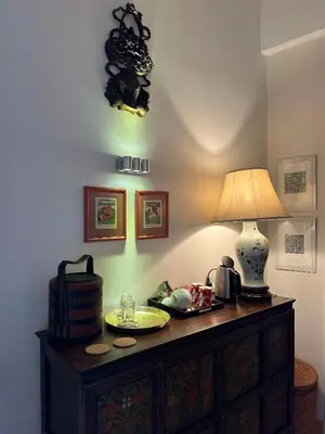 a lamp sitting on top of a dresser in a room at La Cour Carrée in Rustrel