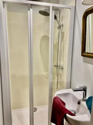 a bathroom with a shower and a sink at Stone house in Isle-sur-la-Sorgue in LʼIsle-sur-la-Sorgue