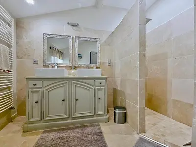 a bathroom with a sink and a mirror at La Bri...Gite in LʼIsle-sur-la-Sorgue