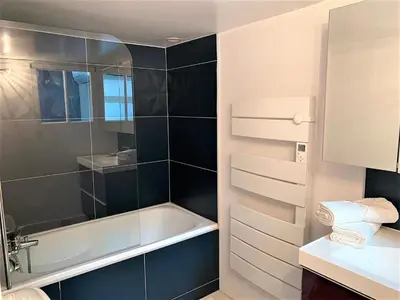 a bathroom with a shower and a bath tub at LE FOCH in Aix-en-Provence