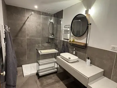 a bathroom with a sink and a mirror at Domaine Hestia in Robion en Luberon