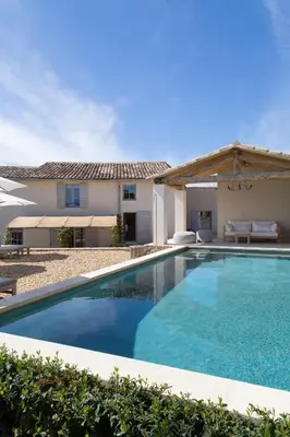 a swimming pool in front of a house at Villa Vagabonde in Gordes