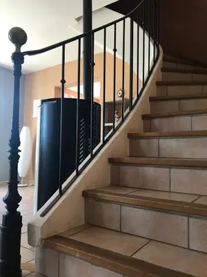 a set of stairs with a trash can at La Bastide de l'Olivier in Flassan