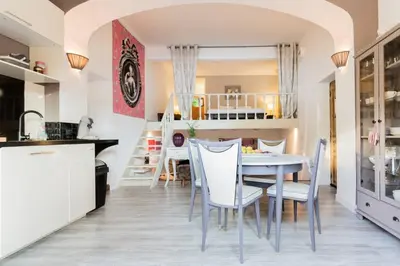 a kitchen and dining room with a table and chairs at La maison de Tao in Aix-en-Provence