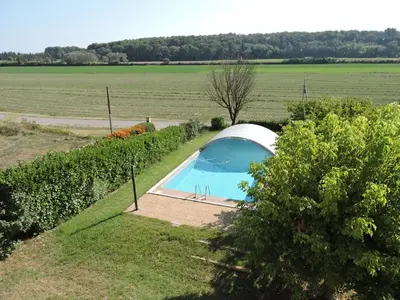 a tent with a swimming pool in a field at Loue haut de villa au calme piscine jardin arboré in Cornillon-Confoux