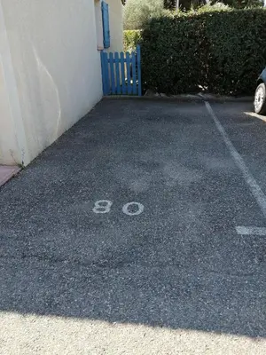 a parking lot with the number on it at La perle des Alpilles Résidence les MYRTILLES in Eyguières
