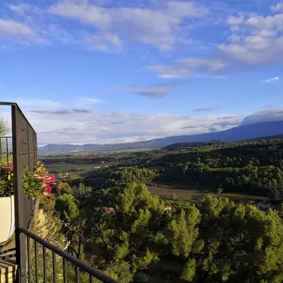 a view of a valley from a balcony at Les Maisons Mado in Venasque