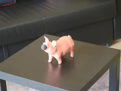 a small pink dog toy sitting on a table at Chez Marielle in LʼIsle-sur-la-Sorgue