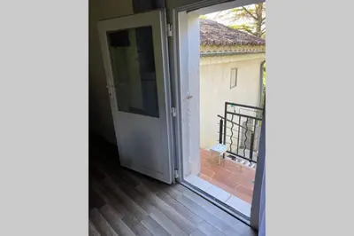 an open door to a balcony with a view at Appartement St Victor in Puyvert