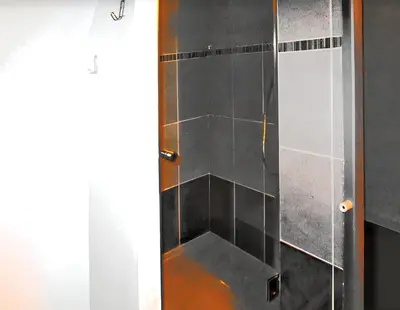 a shower with a glass door in a bathroom at Appartement lumineux à Lançon-Provence, piscine partagée in Lançon-Provence