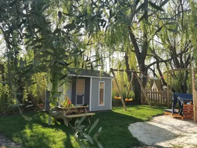 a small shed in a yard with a picnic table at Mas de Férigoulet -