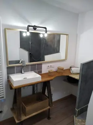 a bathroom with a sink and a mirror at Maison dans quartier calme in LʼIsle-sur-la-Sorgue